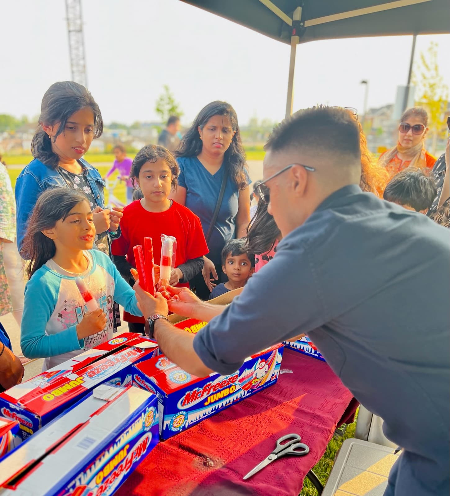 Adil Khalqi with Milton residents